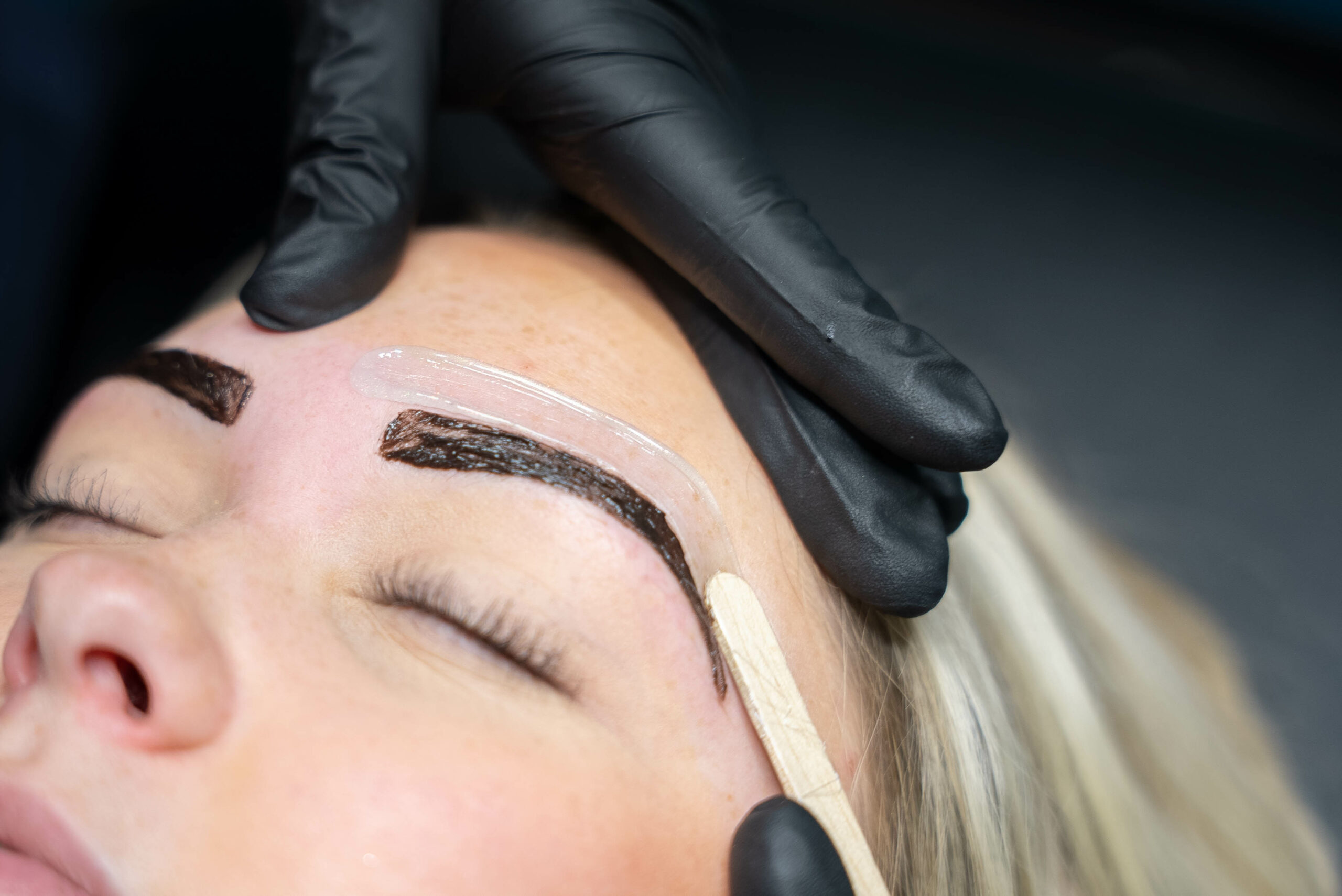 Woman getting eyebrow shaping, wax and eyebrow tint - Skinworks Wellness & Aesthetics - Hendersonville, TN