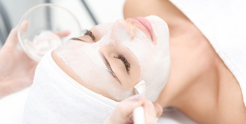 Woman enjoying a relaxing facial for radiant skin - Skinworks Wellness & Aesthetics