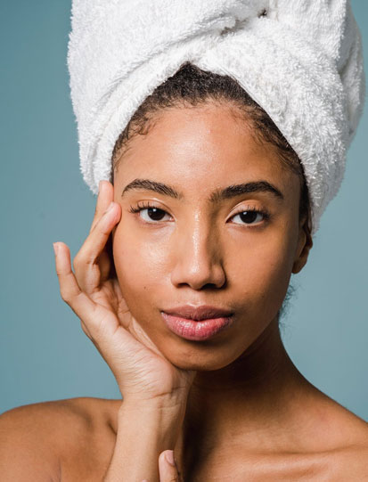 Image of a beautiful black woman prepped for a medical spa treatment/ Exosomes and skin care.