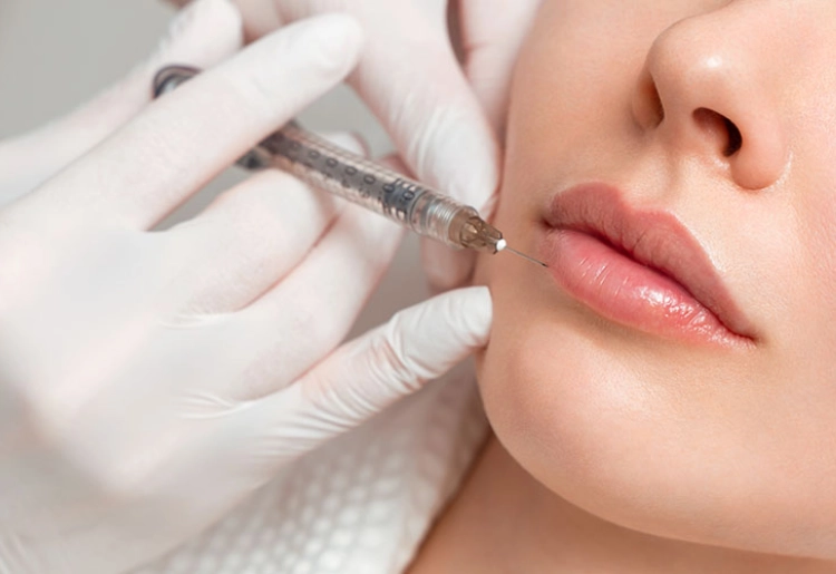 Image of woman receiving Dermal Fillers in lips - injectables & lift services - Skinworks Wellness & Aesthetics - Med Spa Hendersonville, TN