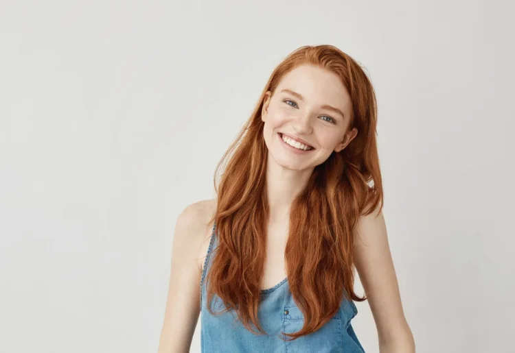Young redheaded woman with beautiful smile and skin - Skinworks Skinsolutions Wellness & Aesthetics - Medspa Hendersonville, TN