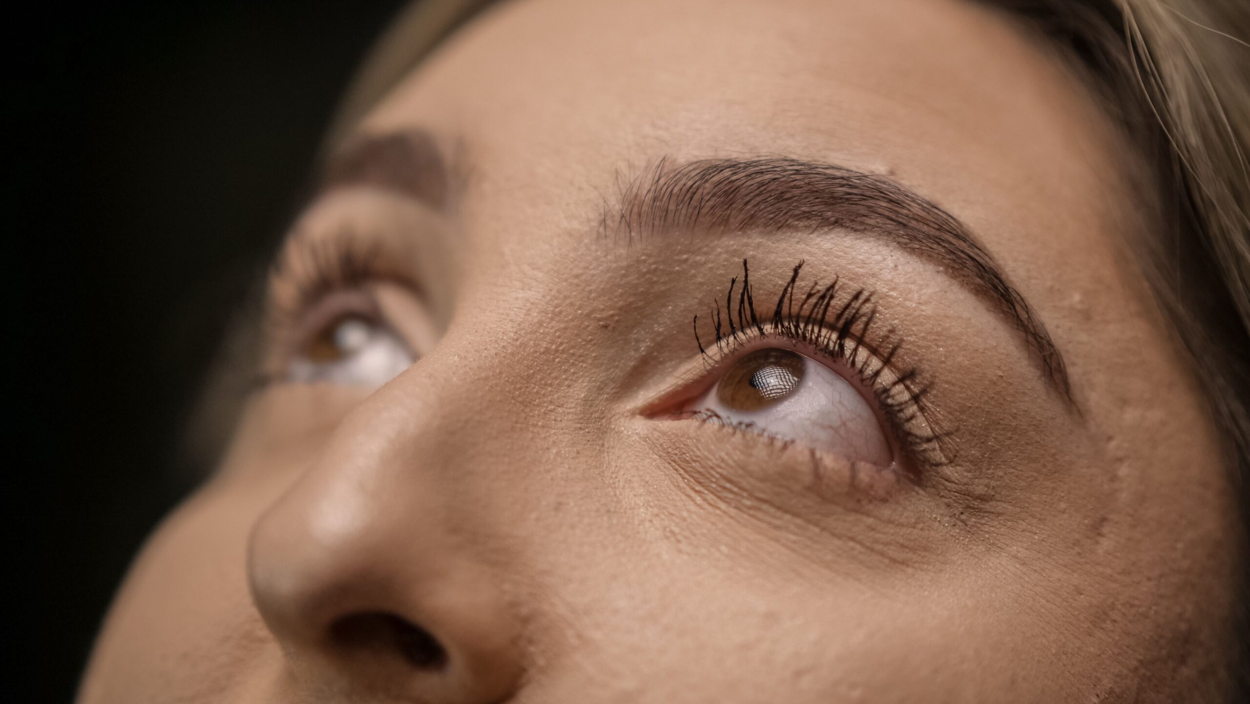 close up of a woman with brow lamination